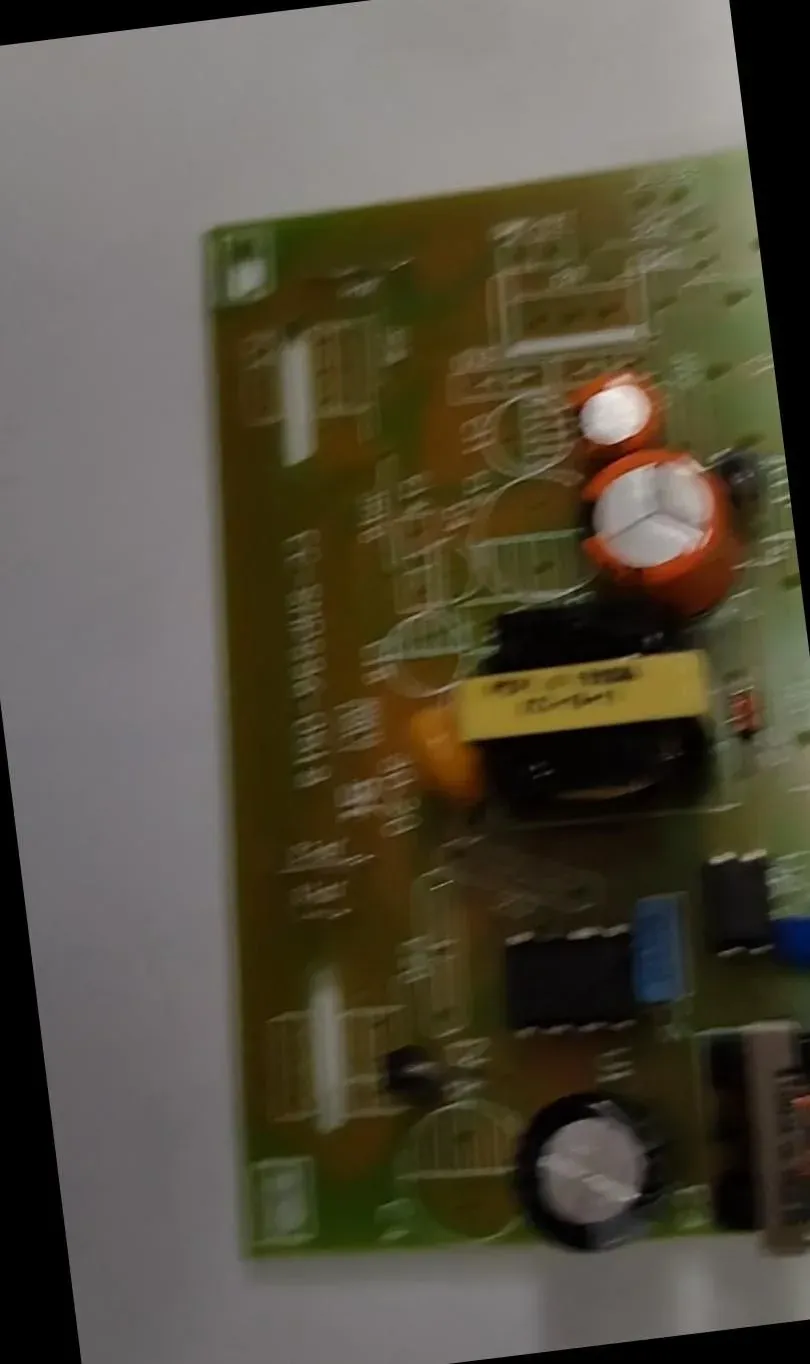 A circuit board photo smeared by motion blur, component markings unreadable