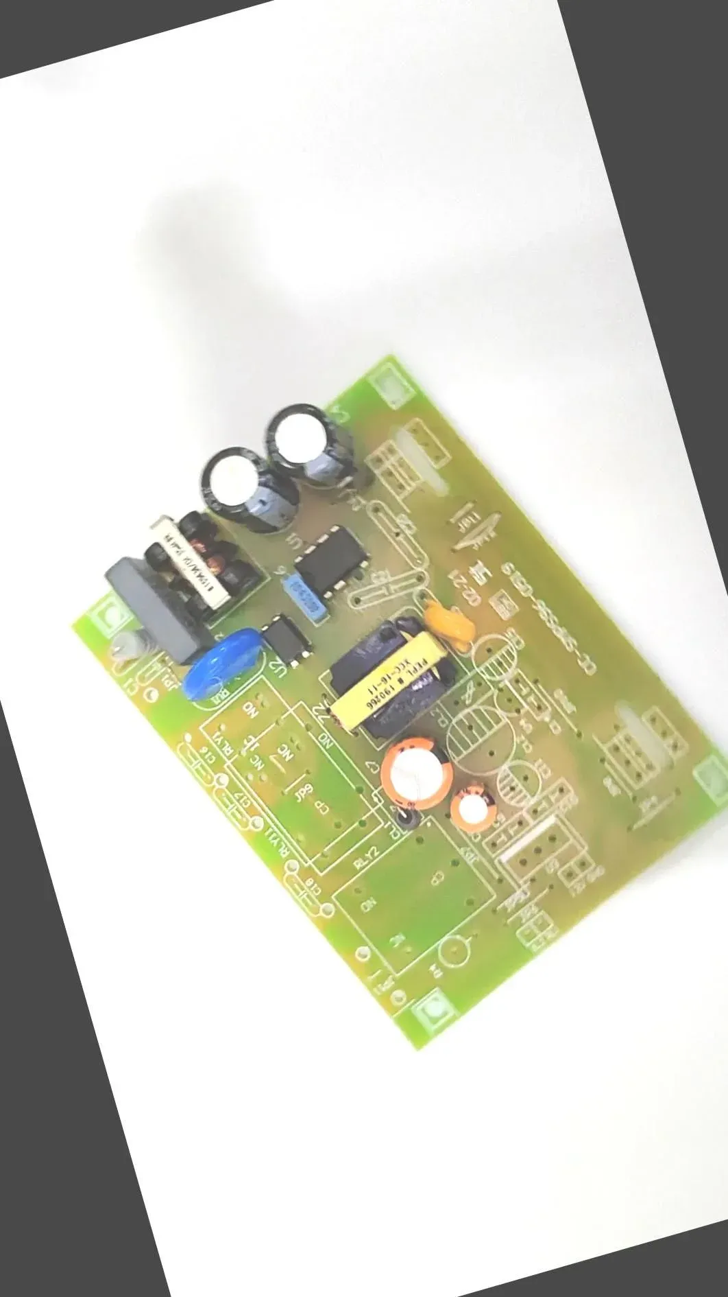 A circuit board photo, rotated, with gray fill in the corners